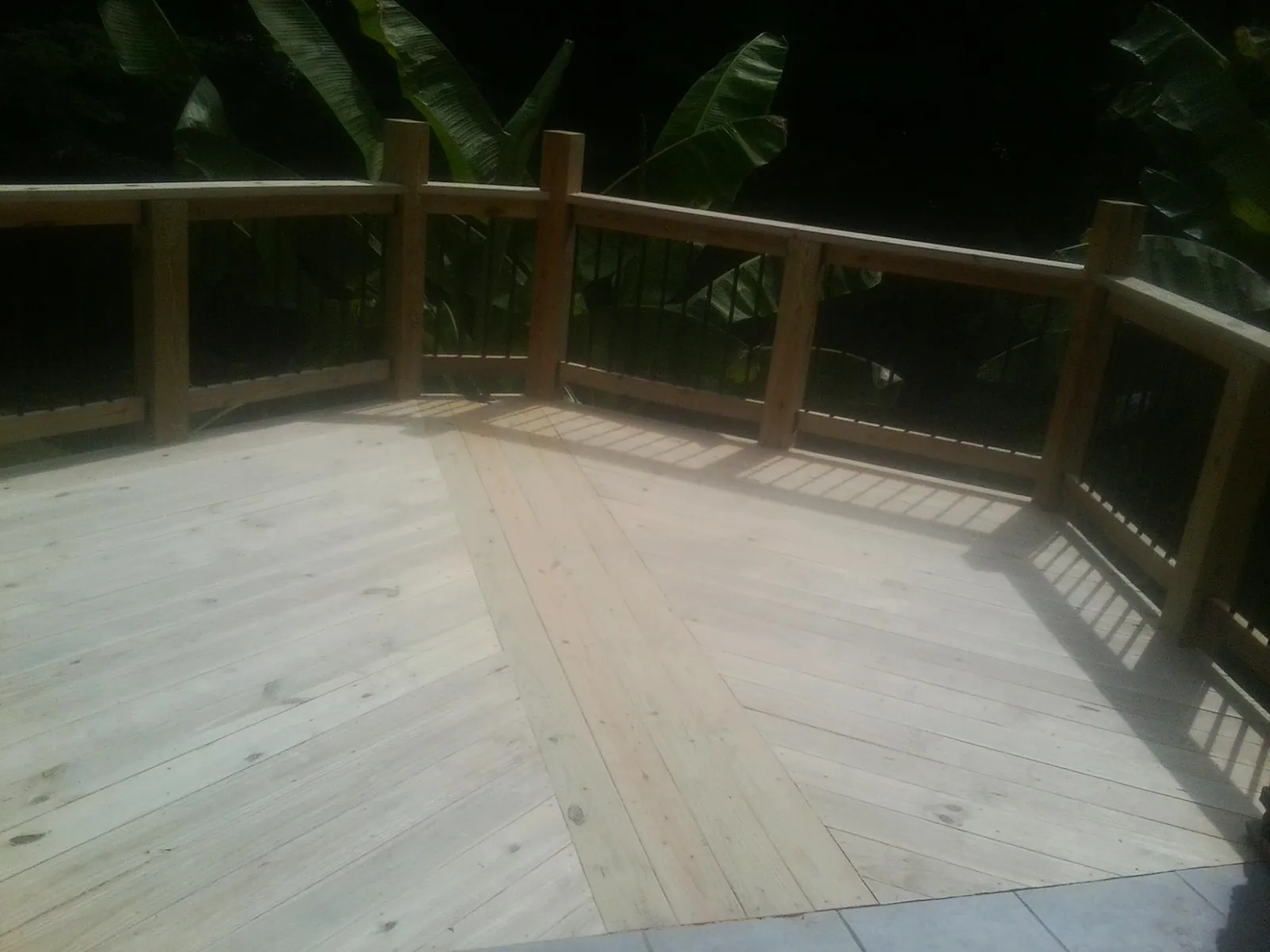 New wood deck and railing built off the back of a home in Sun Prairie